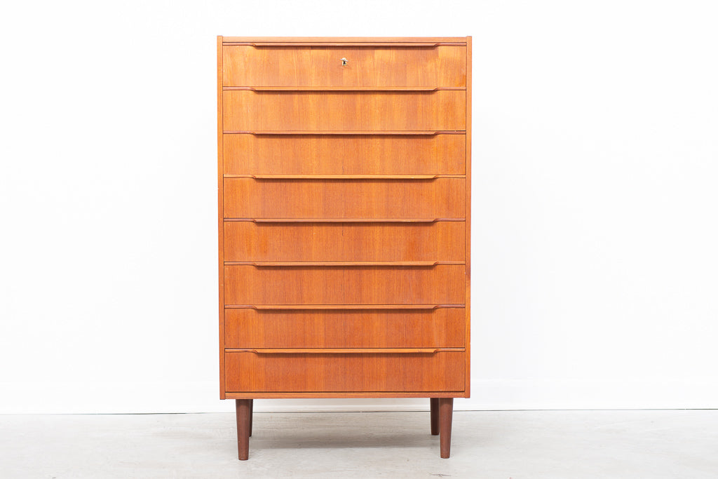 Tall teak chest of eight drawers