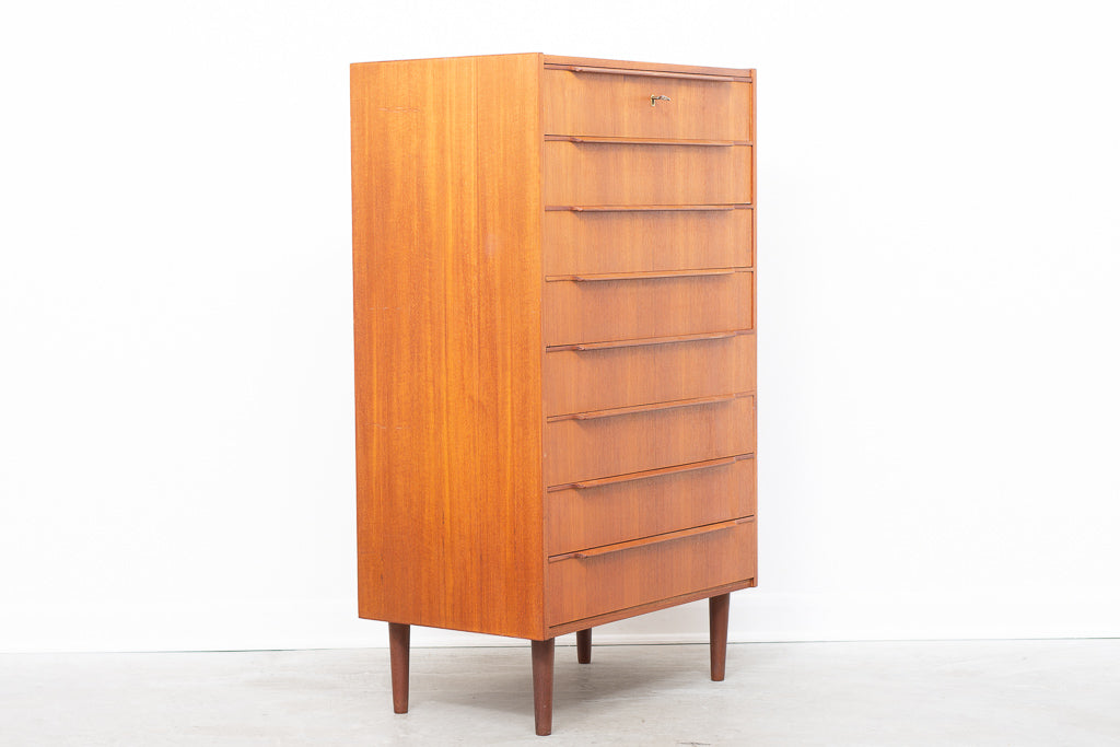 Tall teak chest of eight drawers