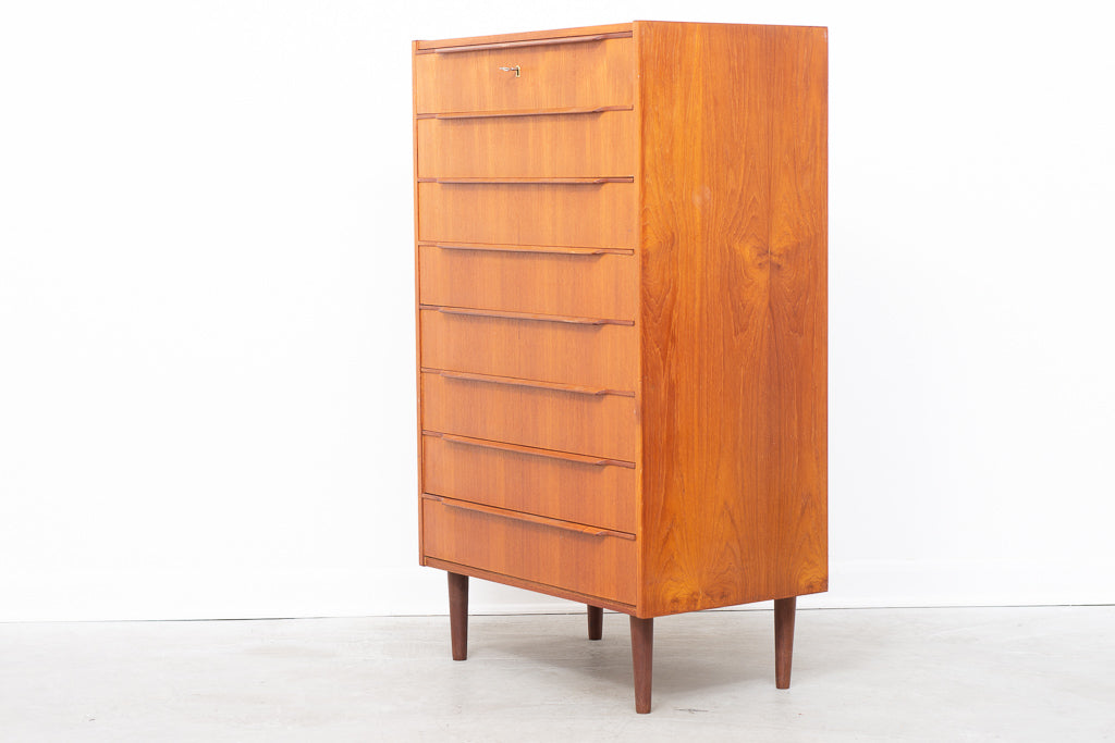 Tall teak chest of eight drawers