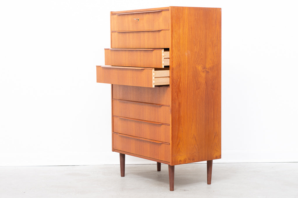 Tall teak chest of eight drawers