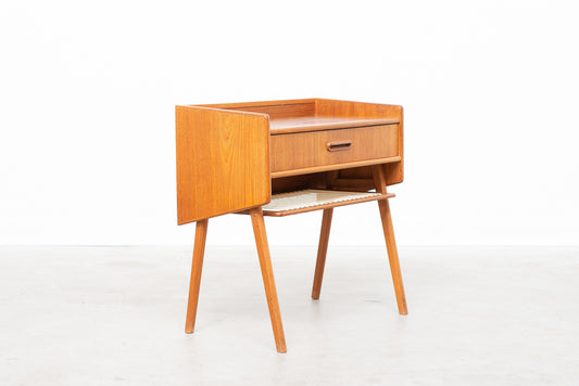 Teak storage unit on splayed legs