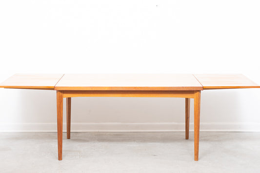 Large extending teak dining table