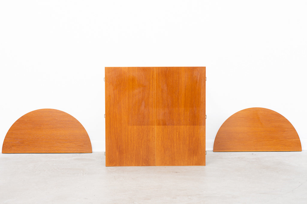 Extending square dining table in teak