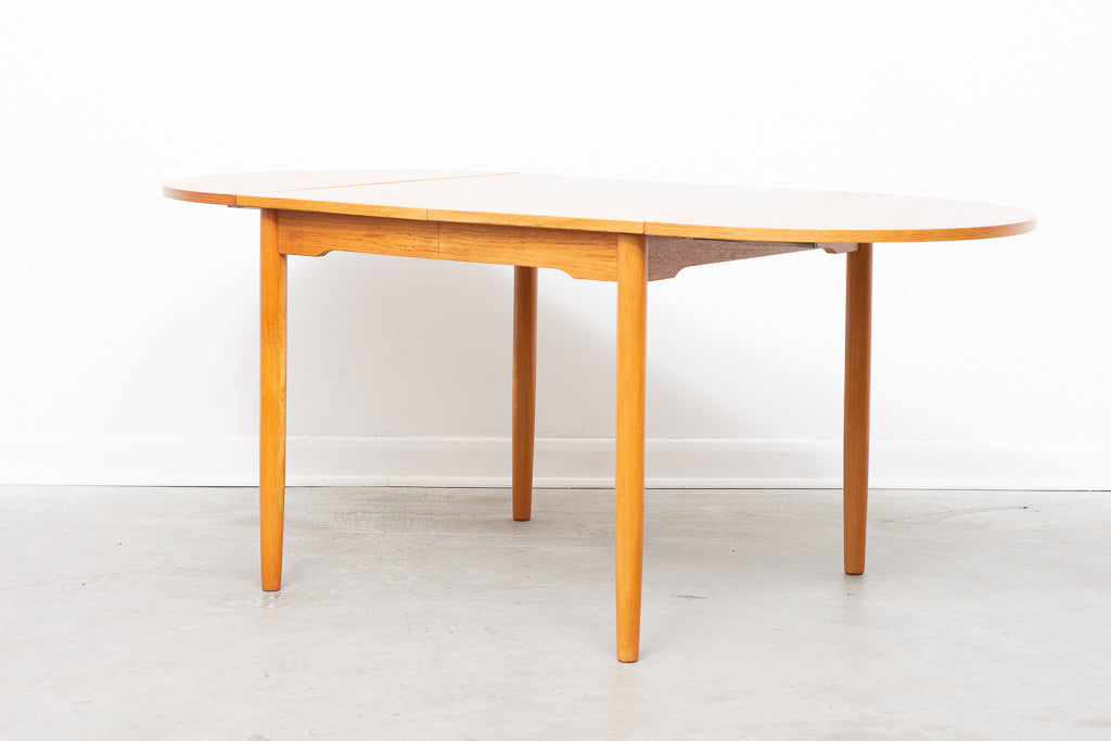 Extending square dining table in teak