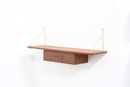 Floating shelf in teak with brass supports