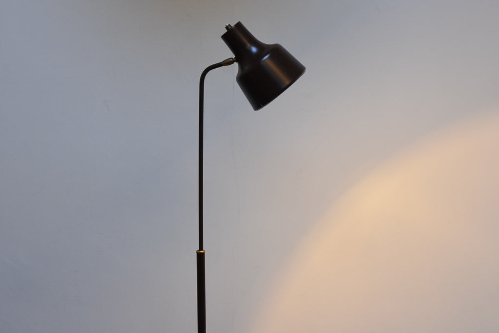 Height-adjustable floor lamp on tripod base