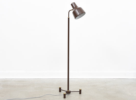 Height-adjustable floor lamp on tripod base