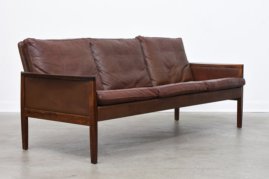 Three seat leather + rosewood sofa by Hans Olsen