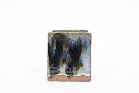 Rectangular stoneware vase with running glaze