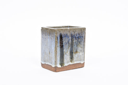 Rectangular stoneware vase with running glaze