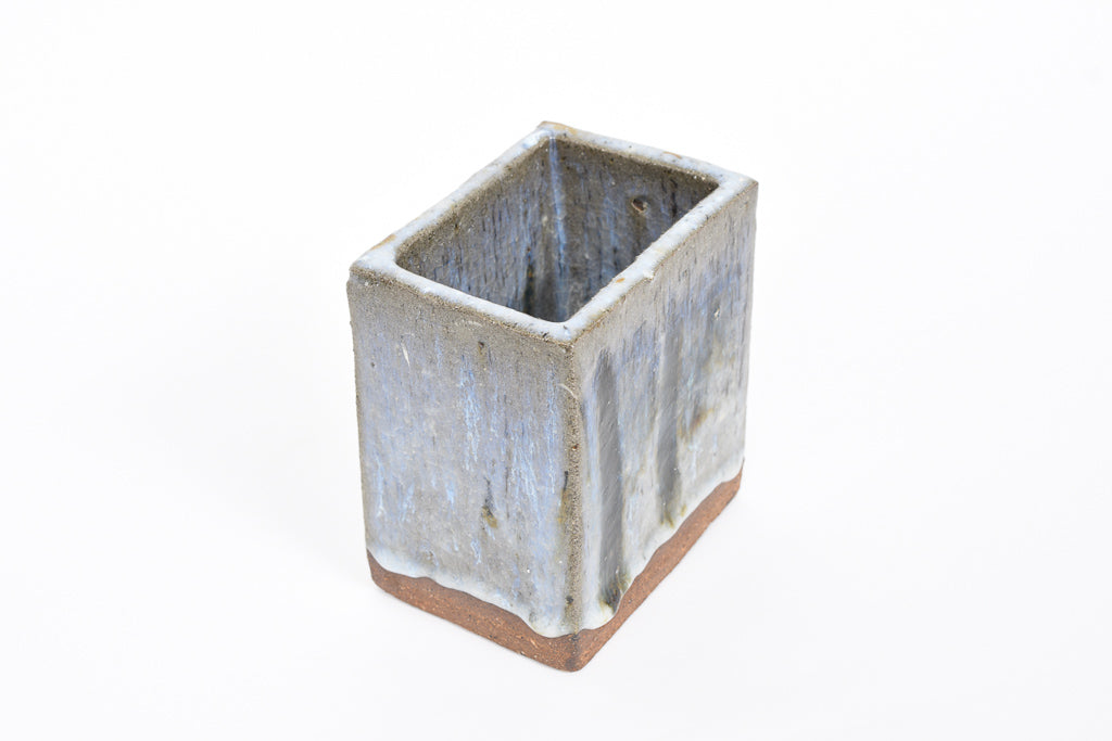 Rectangular stoneware vase with running glaze