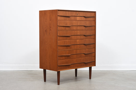 Teak chest of drawers with sculpted handles