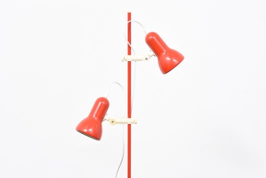 Red twin-headed floor lamp