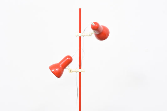 Red twin-headed floor lamp