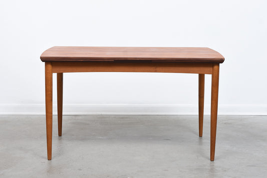 Extending rectangular teak dining table