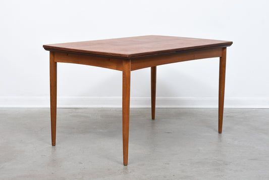 Extending rectangular teak dining table