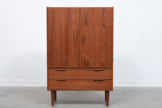 Tall teak storage cabinet