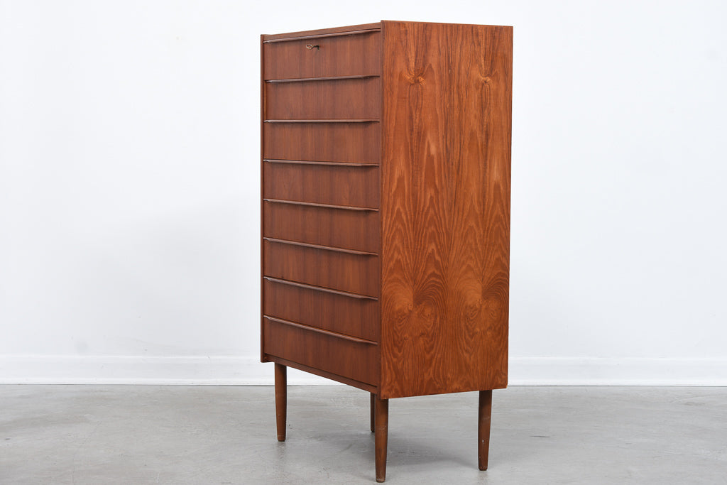 Tall teak chest of eight drawers