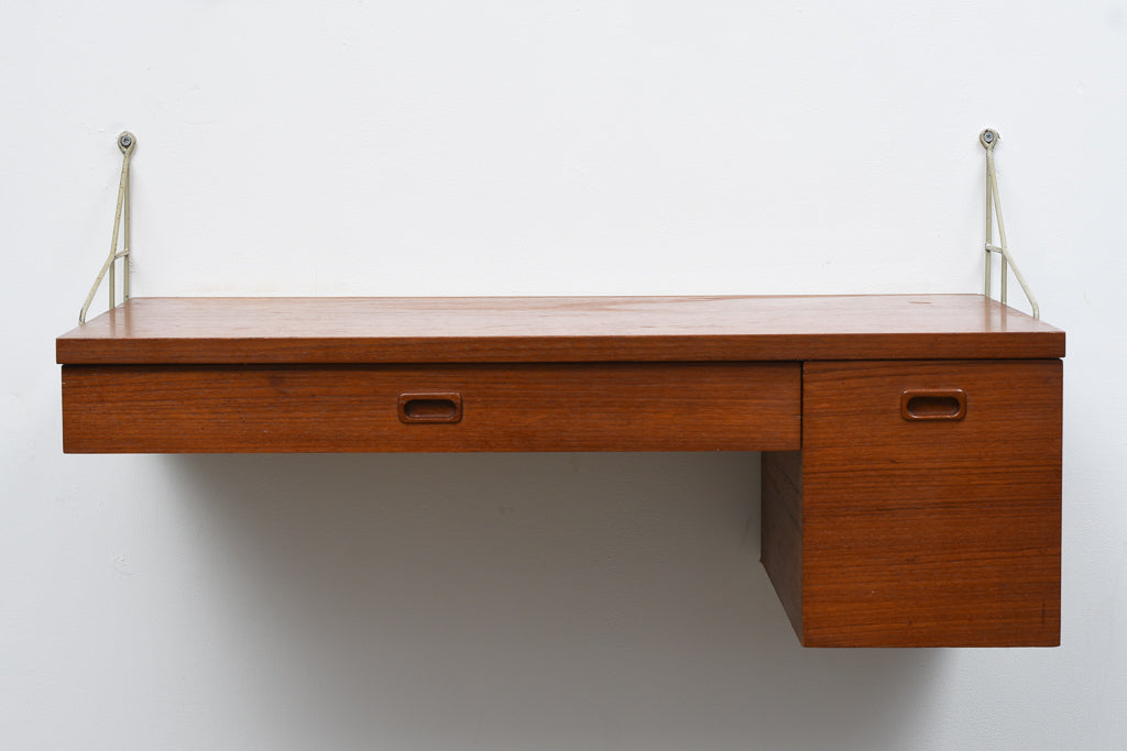 Floating desk in teak with metal wall brackets