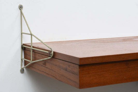 Floating desk in teak with metal wall brackets