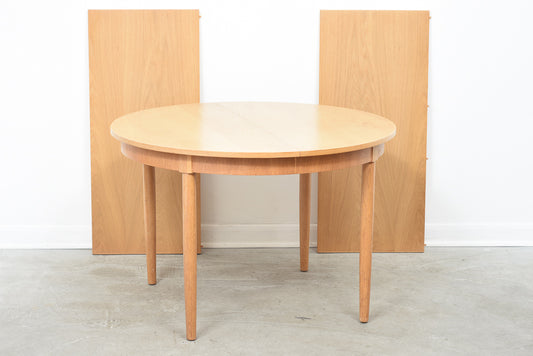 Round extending dining table in oak