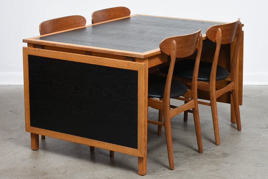 Extending oak dining table by Kai Winding