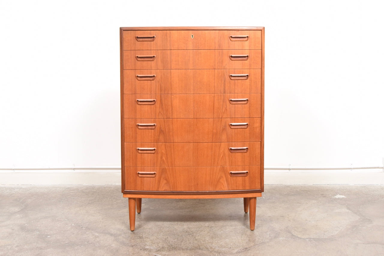 Bow-fronted chest of seven teak drawers