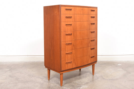 Bow-fronted chest of seven teak drawers