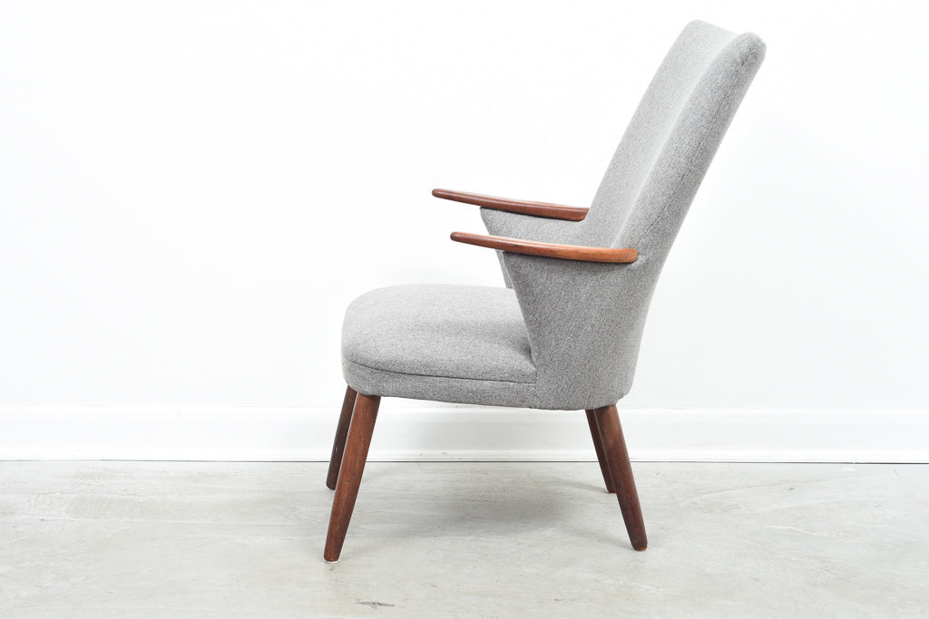 Easy chair in wool with teak arms