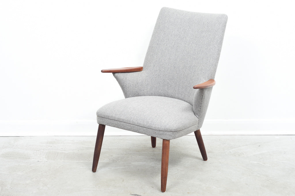 Easy chair in wool with teak arms