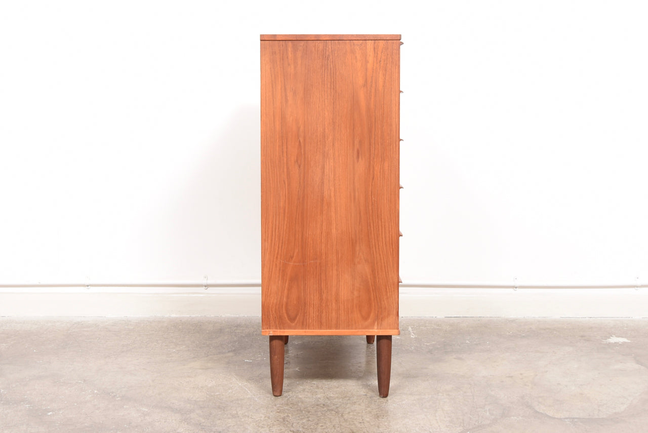 Chest of six teak drawers with lipped handles