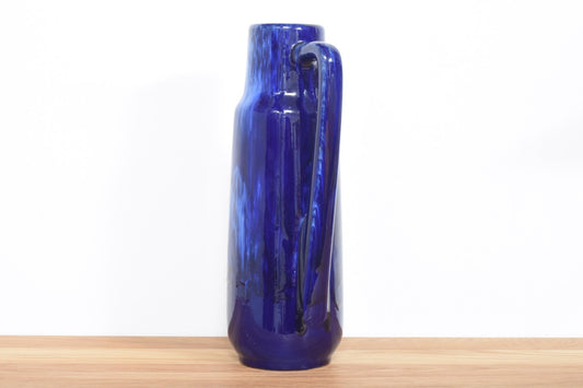 Tall blue pitcher vase