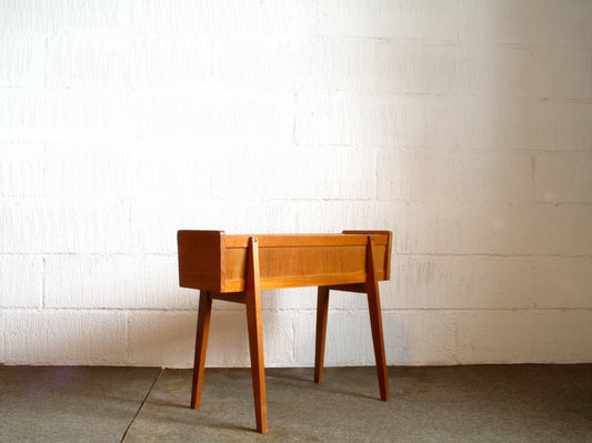 Teak planter on splayed legs