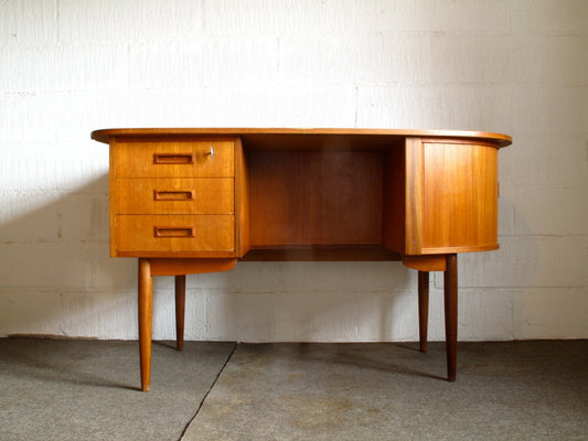 Teak desk with oblong surface