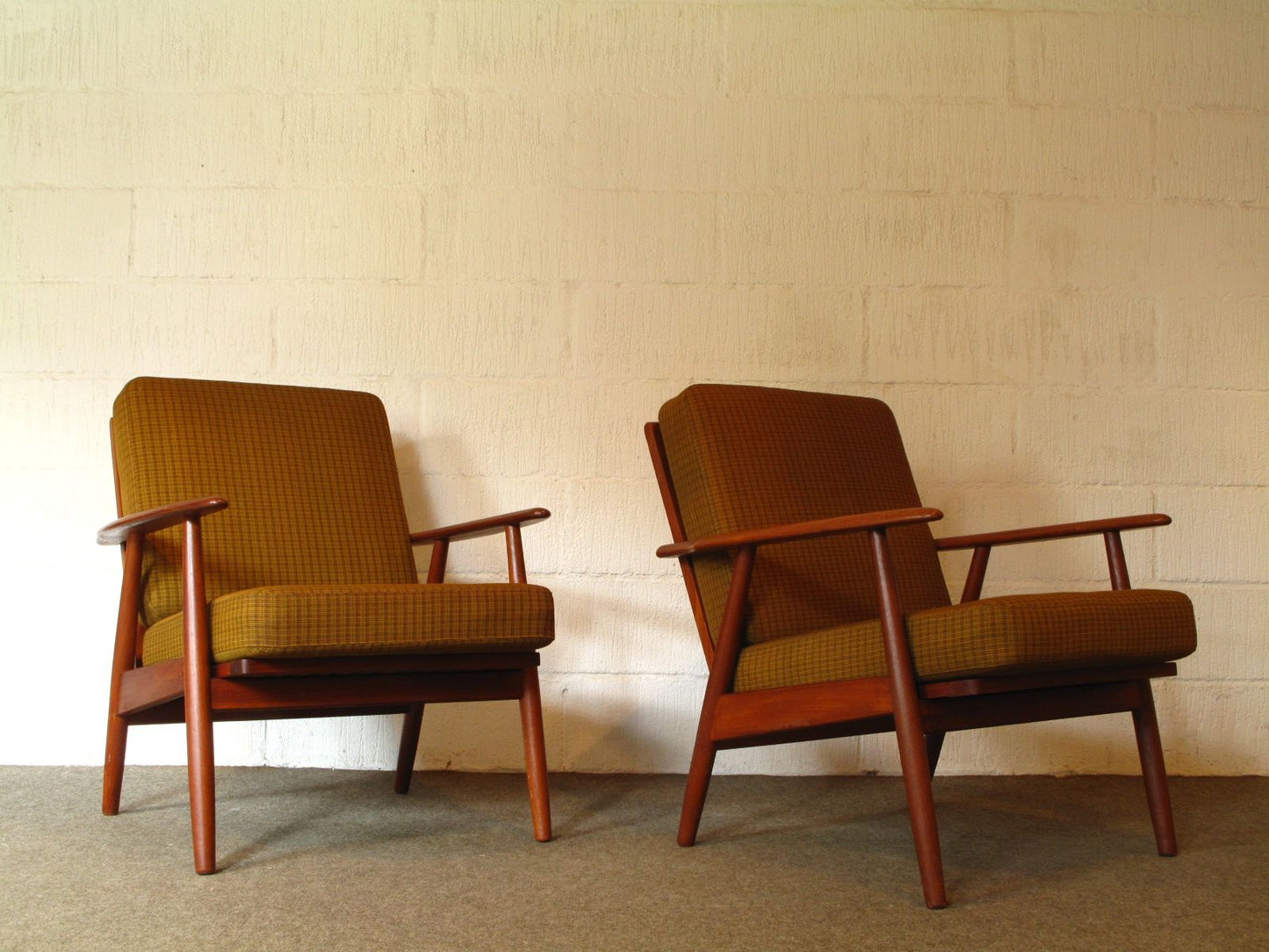 Pair of teak loungers with sprung cushions