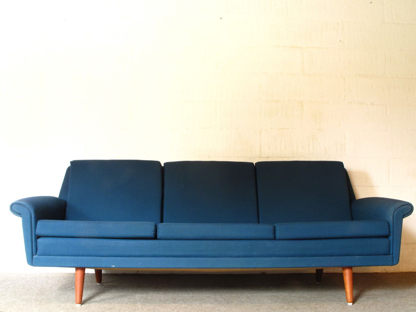 Three seat sofa in sea blue wool
