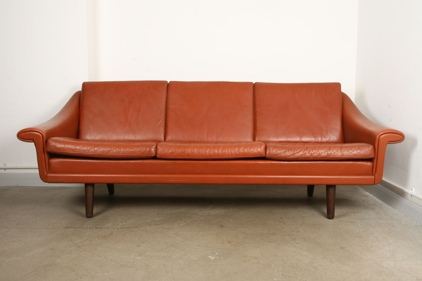 Tan leather three seat sofa