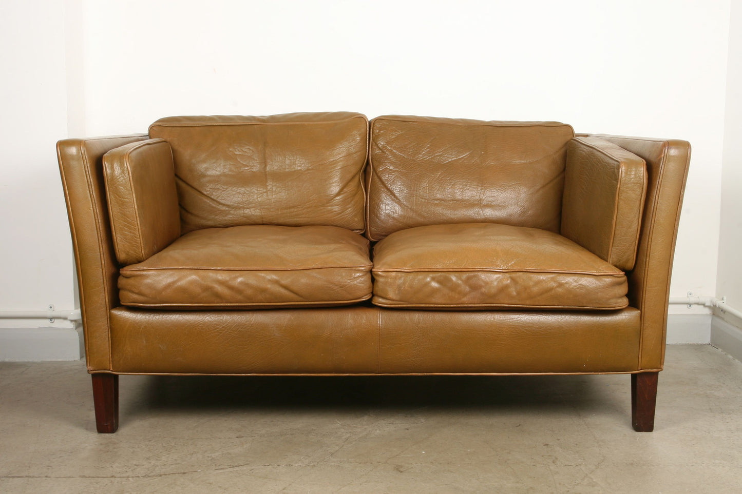 Two seat sofa in buffalo leather
