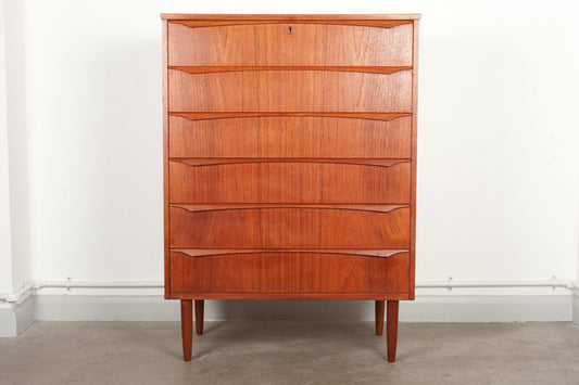 Tall chest of teak drawers