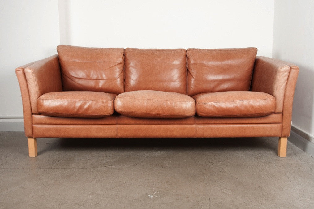 Tan leather three seat sofa