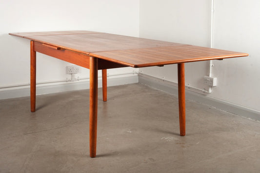 Extending teak dining table