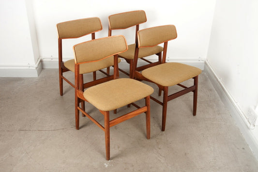 Set of four teak dining chairs