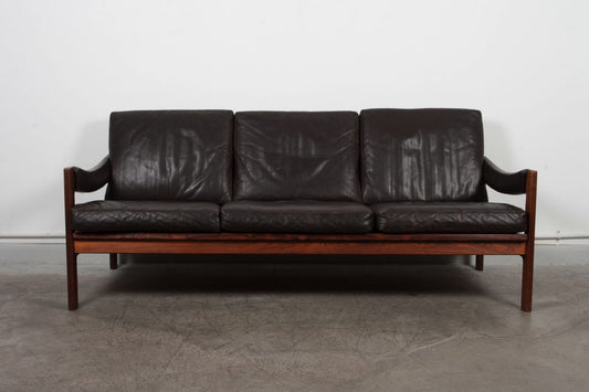 Three seat rosewood and leather sofa