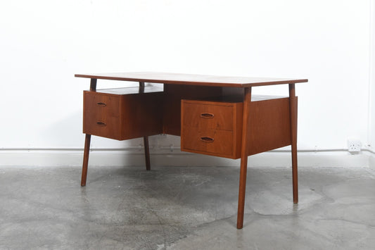 Double sided teak desk