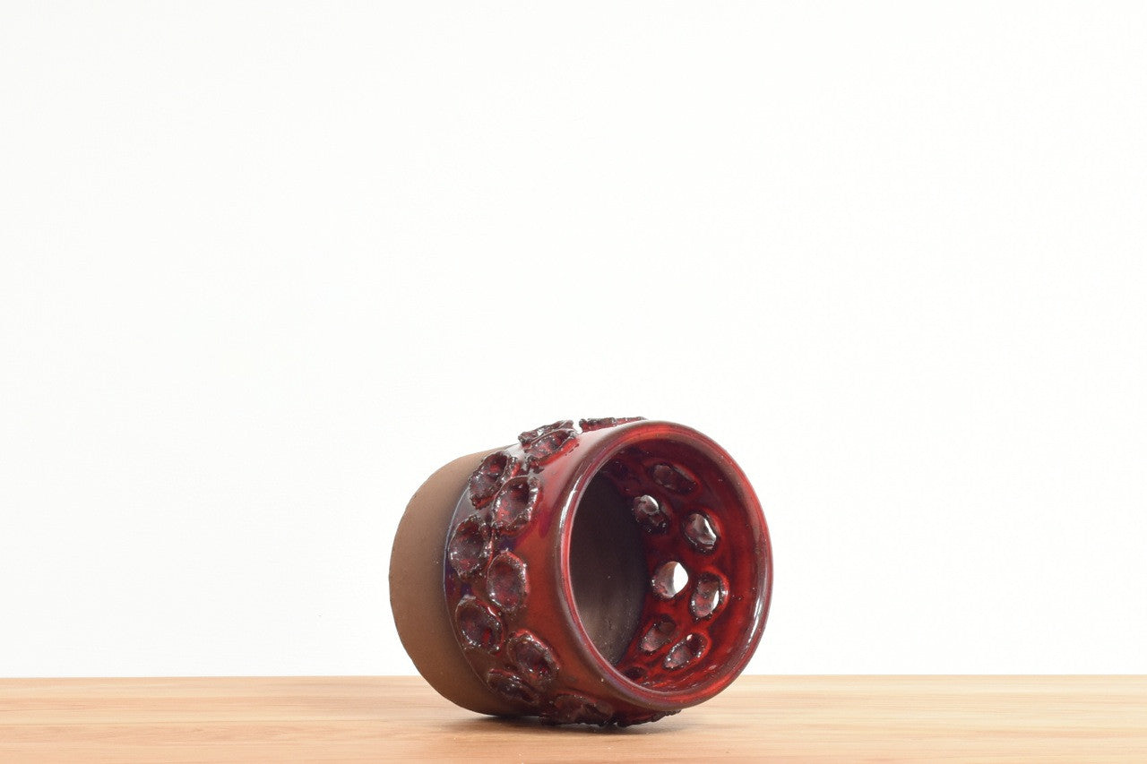 Stoneware candle holder with red glaze