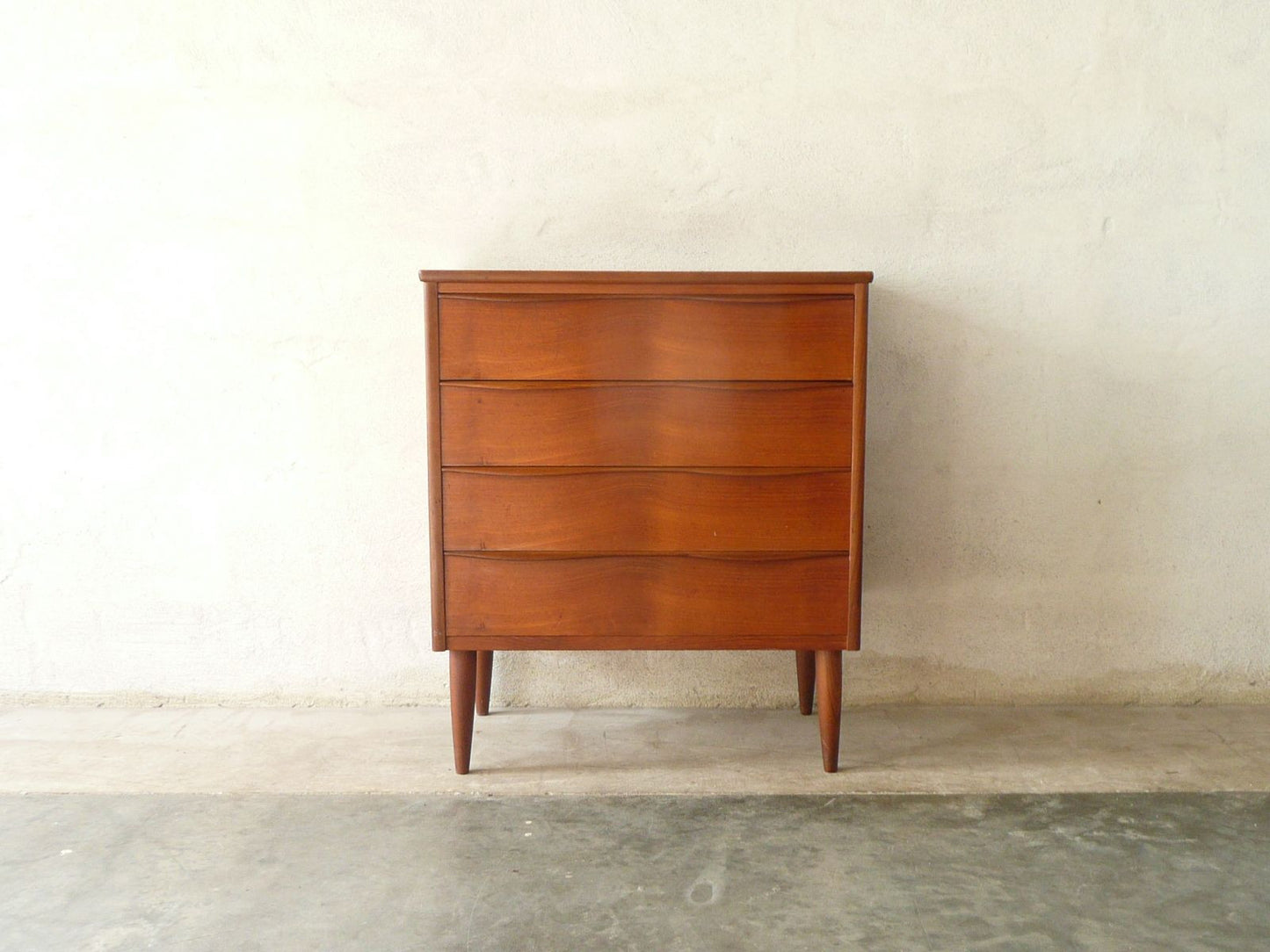 Short chest of four drawers with lipped handles
