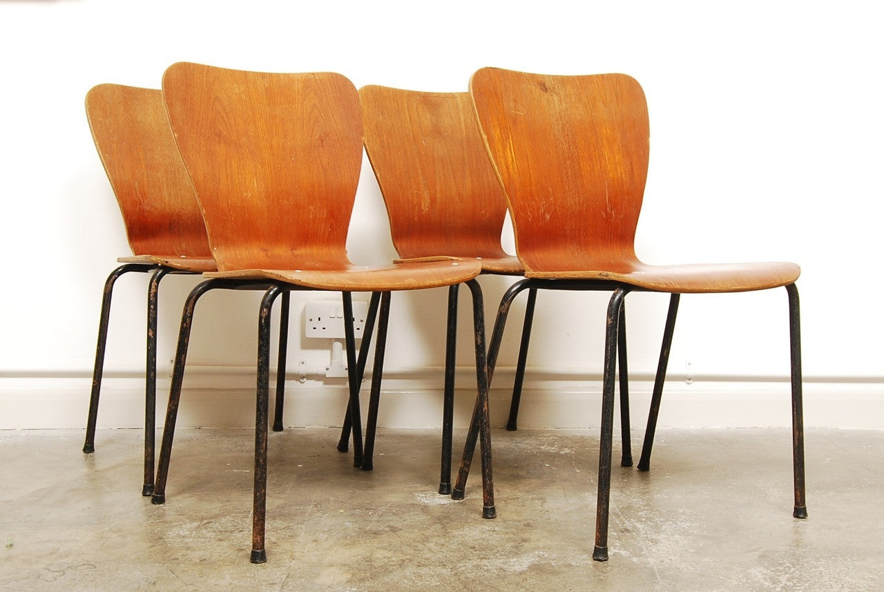 Set of four teak stacking chairs