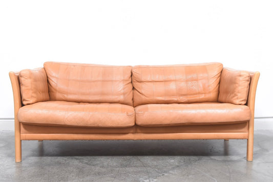 Two and a half seater in tan leather