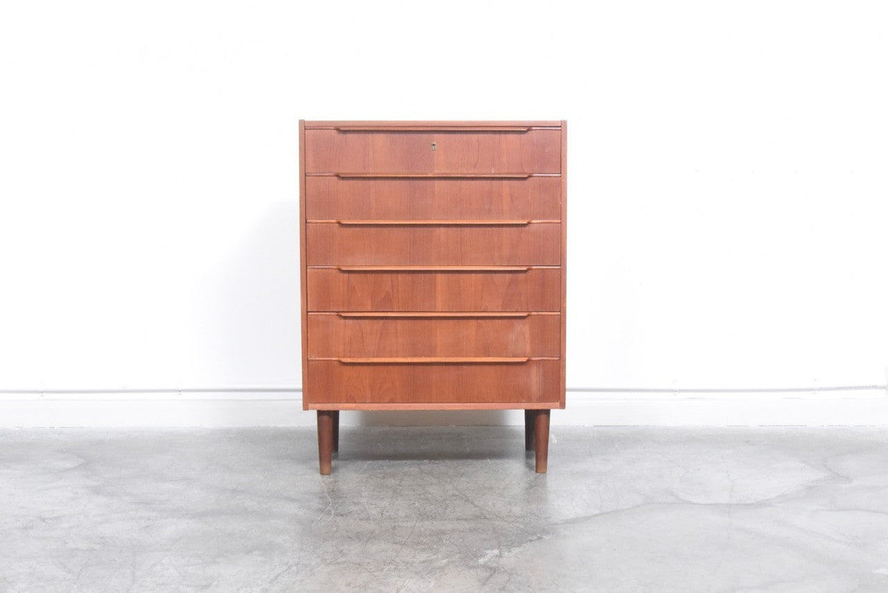 Teak chest of drawers with lipped handles