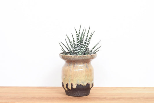 Stoneware planter with running glaze